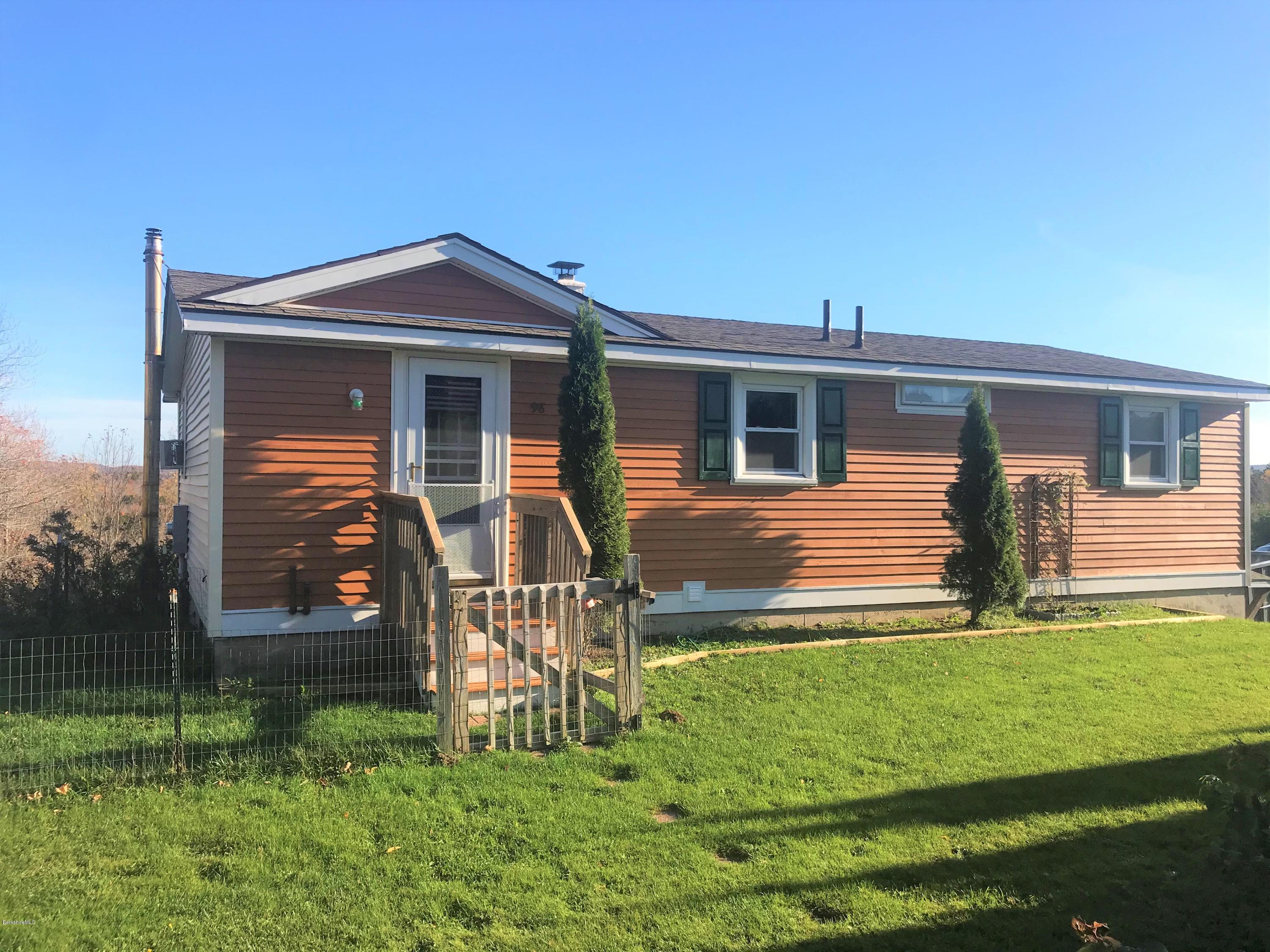 98 Loop Road Savoy, MA 01256 - Photo 1 of 20 a front view of a house with a yard