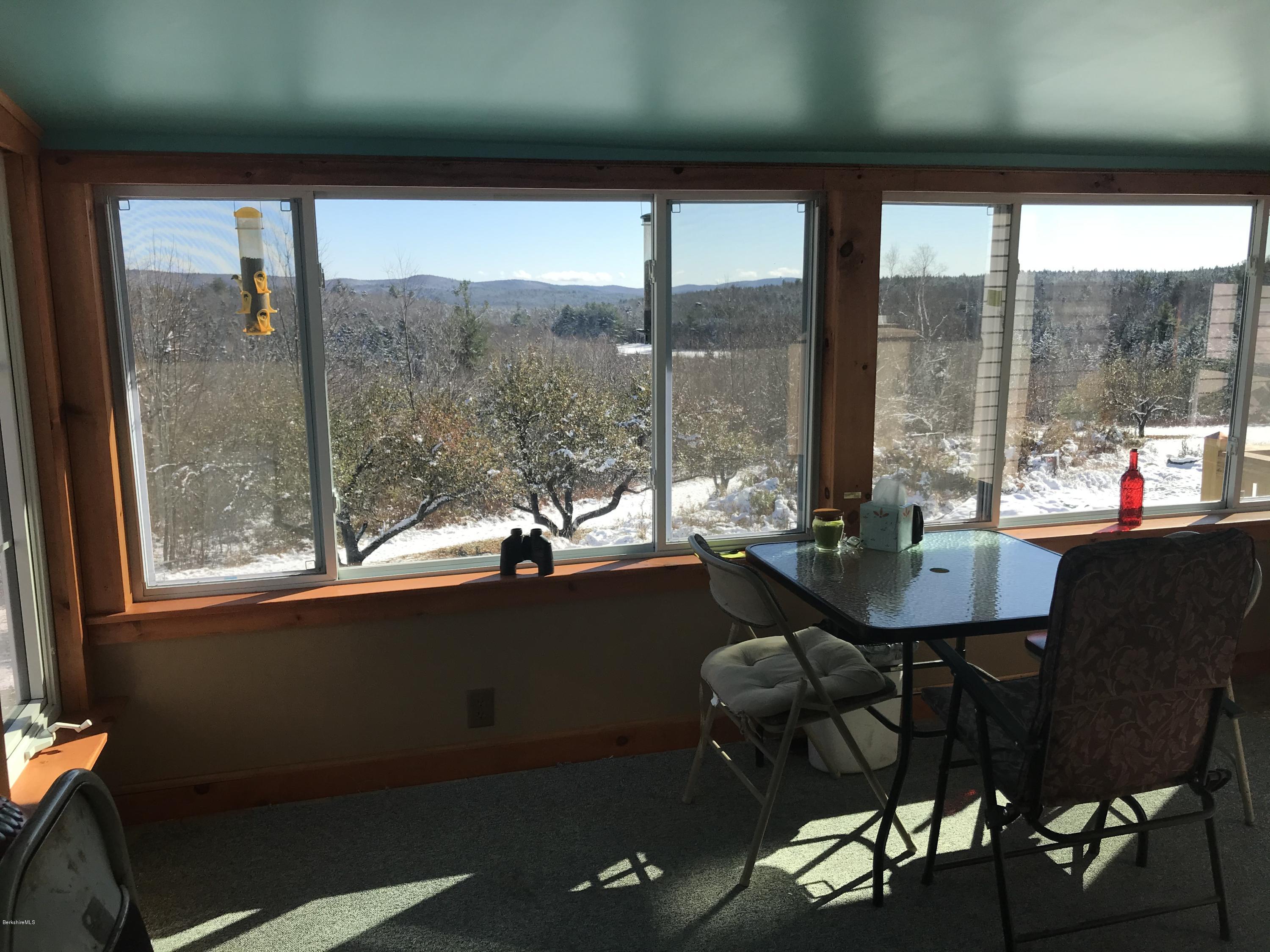 98 Loop Road Savoy, MA 01256 - Photo 5 of 20 a view of a dining room with furniture window and outside view