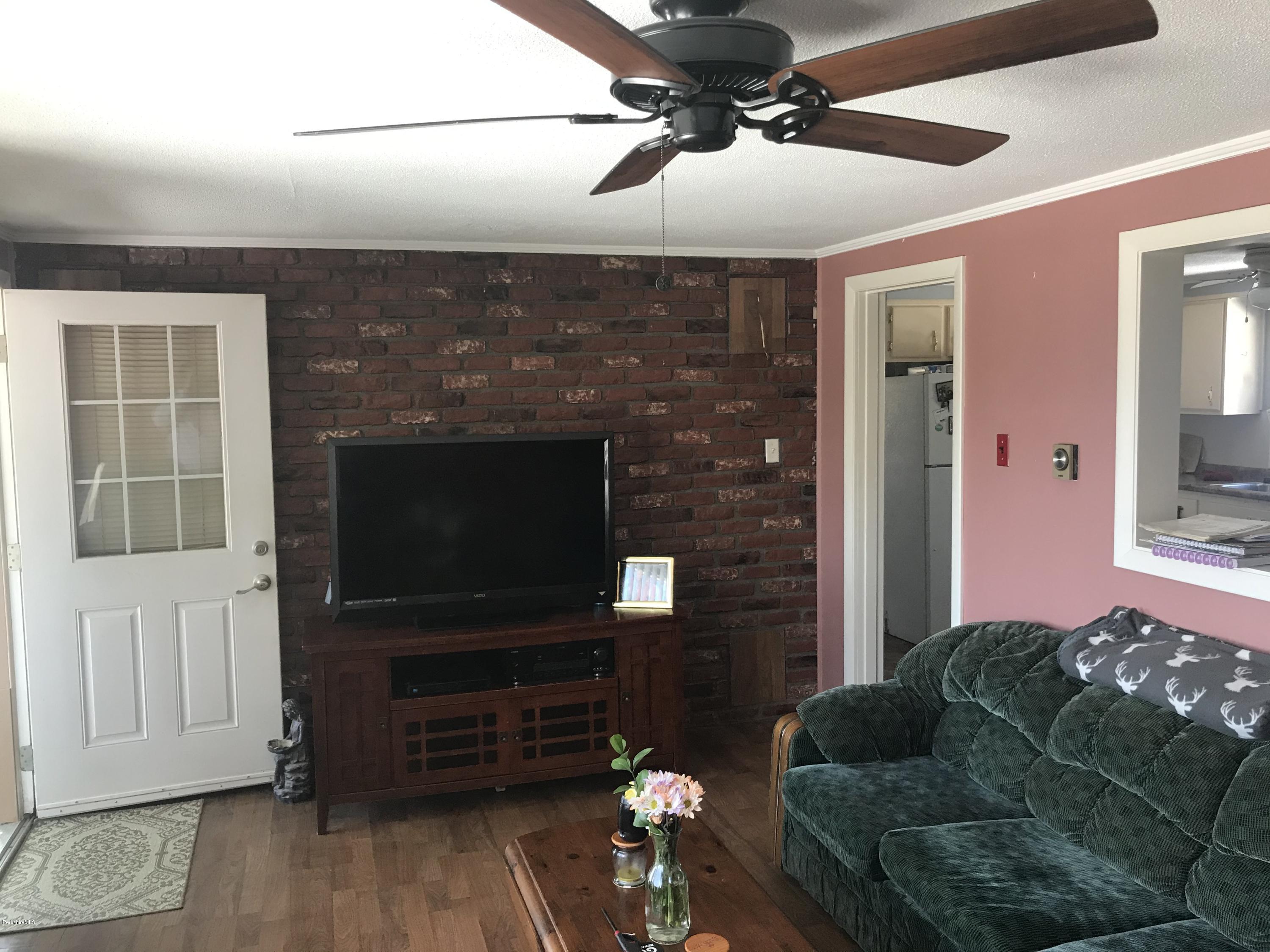 98 Loop Road Savoy, MA 01256 - Photo 6 of 20 a living room with furniture and a flat screen tv