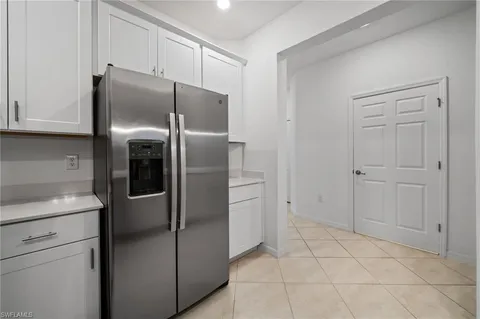 a kitchen with cabinets and stainless steel appliances