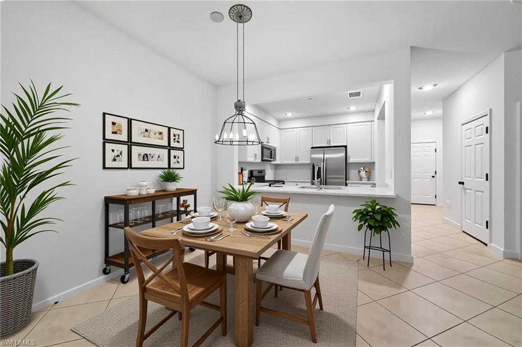 2878 Blossom Way Naples, FL 34120 - Photo 2 of 41 a view of a dining room with furniture window and wooden floor