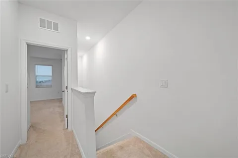 a view of a hallway with an entryway