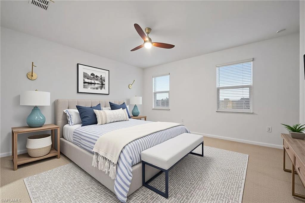 2878 Blossom Way Naples, FL 34120 - Photo 3 of 41 a bedroom with a bed and a lamp on dresser