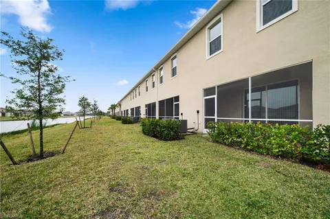 a view of a house with a big yard
