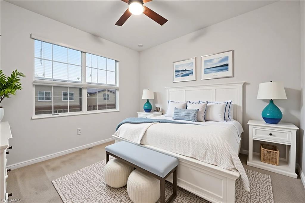 2878 Blossom Way Naples, FL 34120 - Photo 5 of 41 a living room with furniture and a fireplace