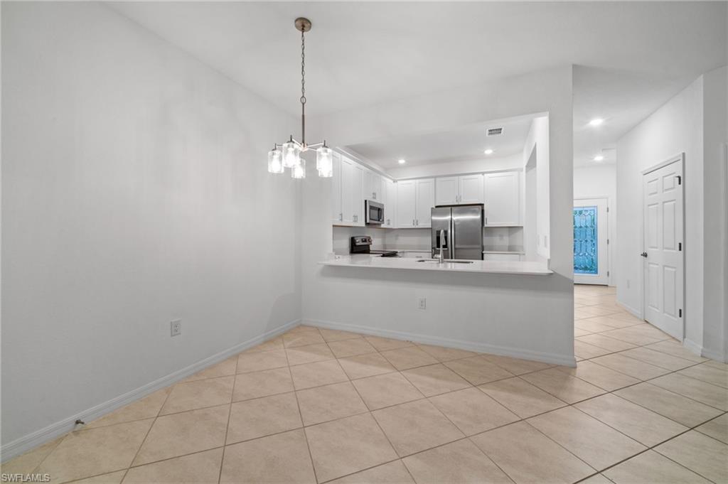 2878 Blossom Way Naples, FL 34120 - Photo 8 of 41 a view of kitchen and window