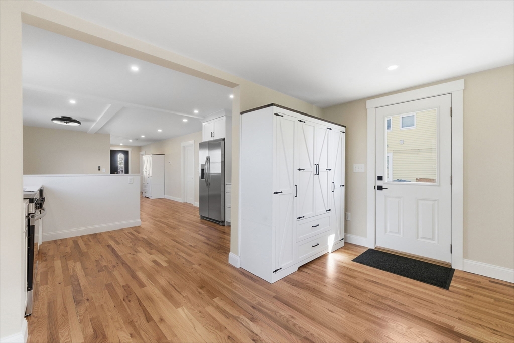 20 Beacon Street, Unit 1 Gloucester, MA 01930 - Photo 12 of 17 a view of a kitchen with wooden floor