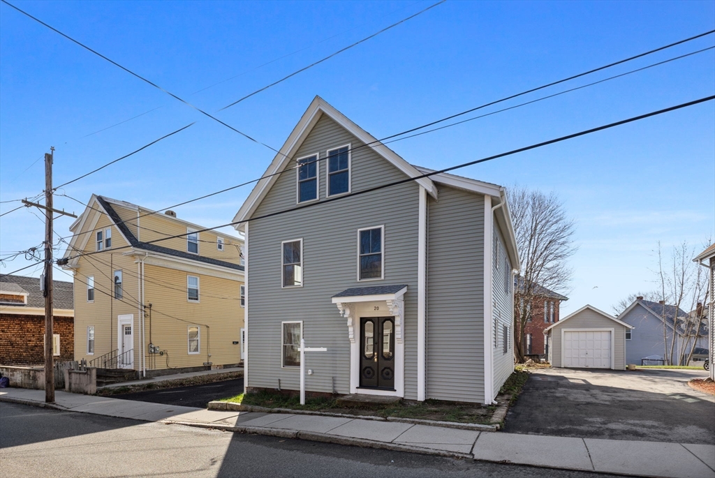 20 Beacon Street, Unit 1 Gloucester, MA 01930 - Photo 16 of 17 a view of a house with a street