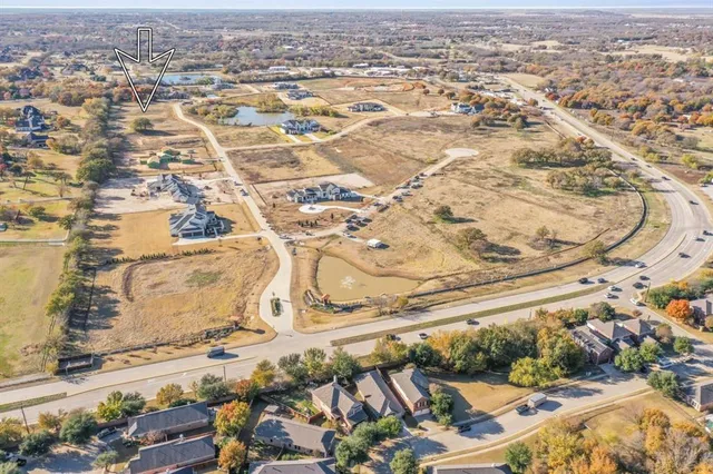 an aerial view of residential building and parking space