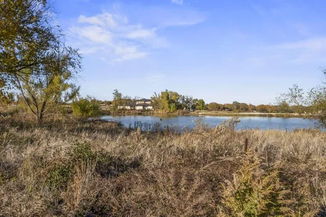 a view of lake with green space