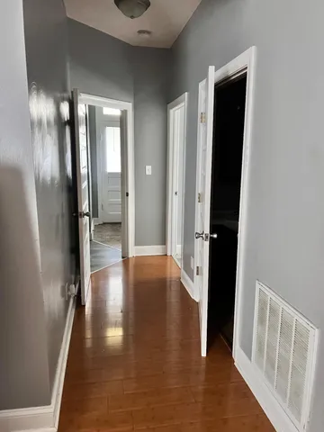 a view of gallery with wooden floor