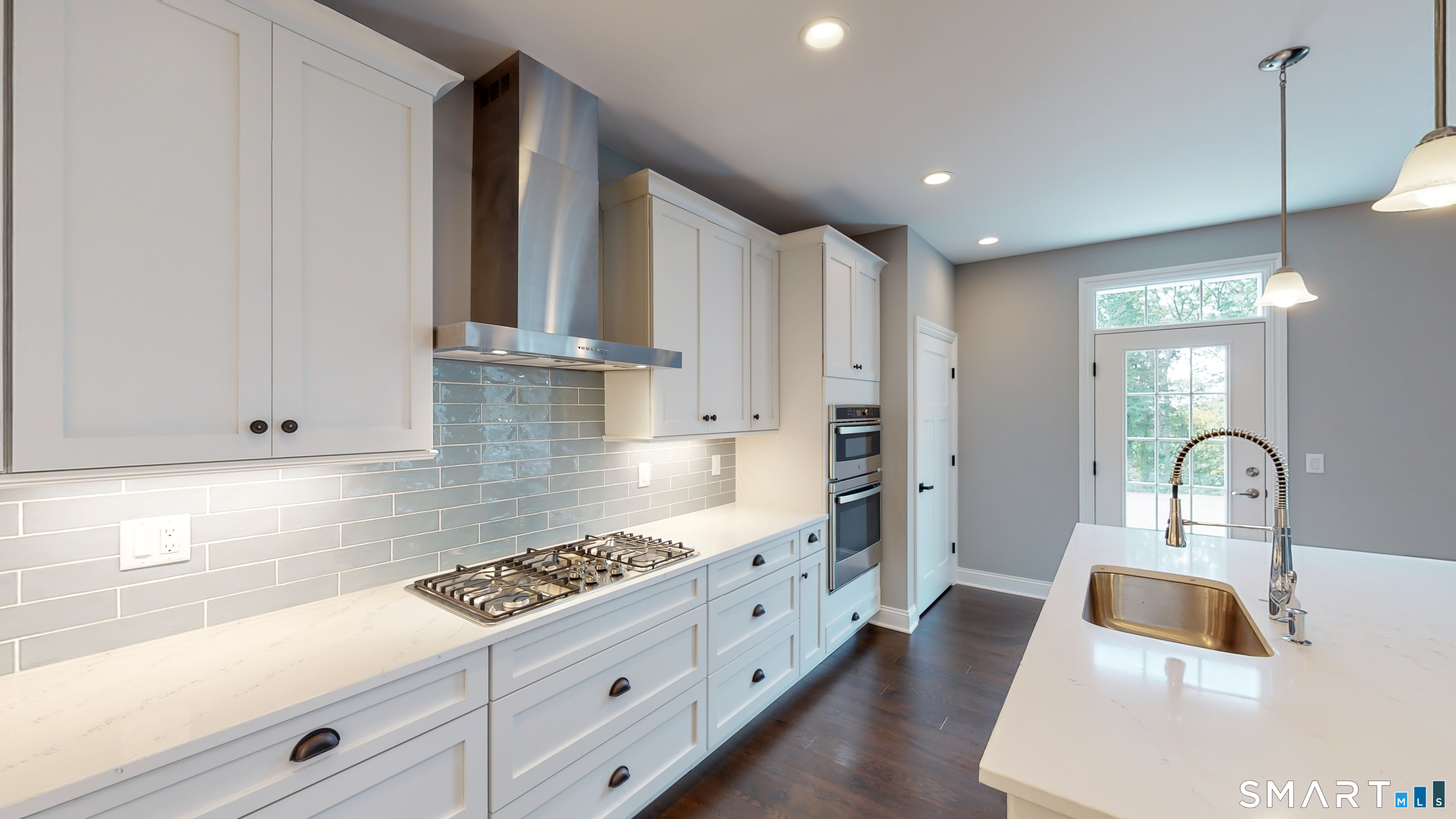 18 Twin Valley Road East Lyme, CT 06333 - Photo 9 of 26 a kitchen with white cabinets and sink