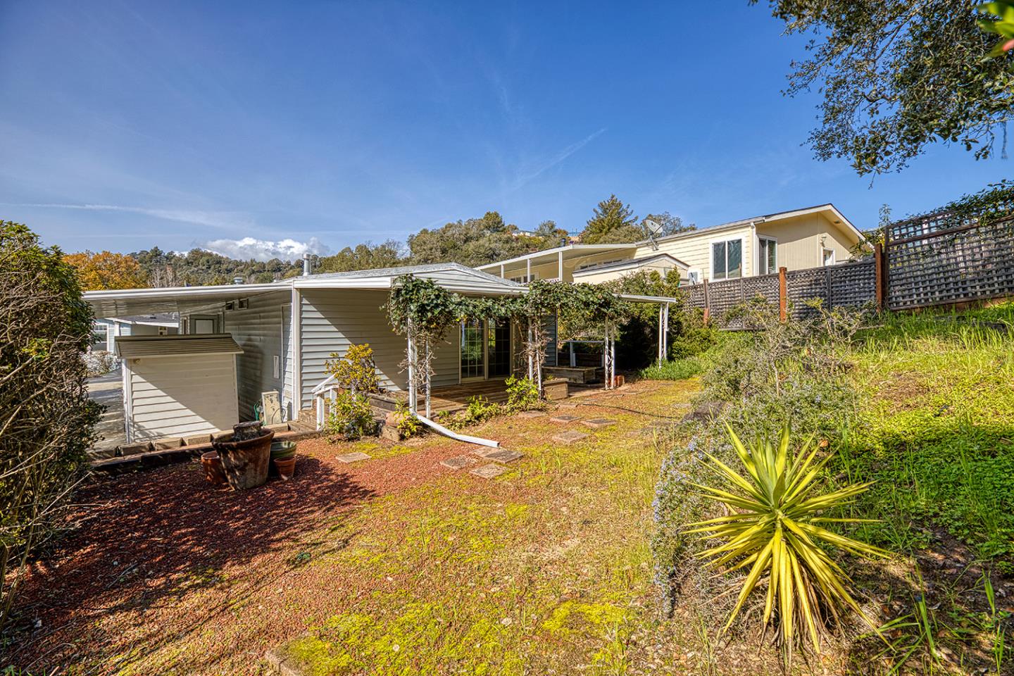 270 Hames Road, Unit 32 Corralitos, CA 95076 - Photo 4 of 7 a front view of a house with a yard