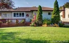 a view of house with front yard