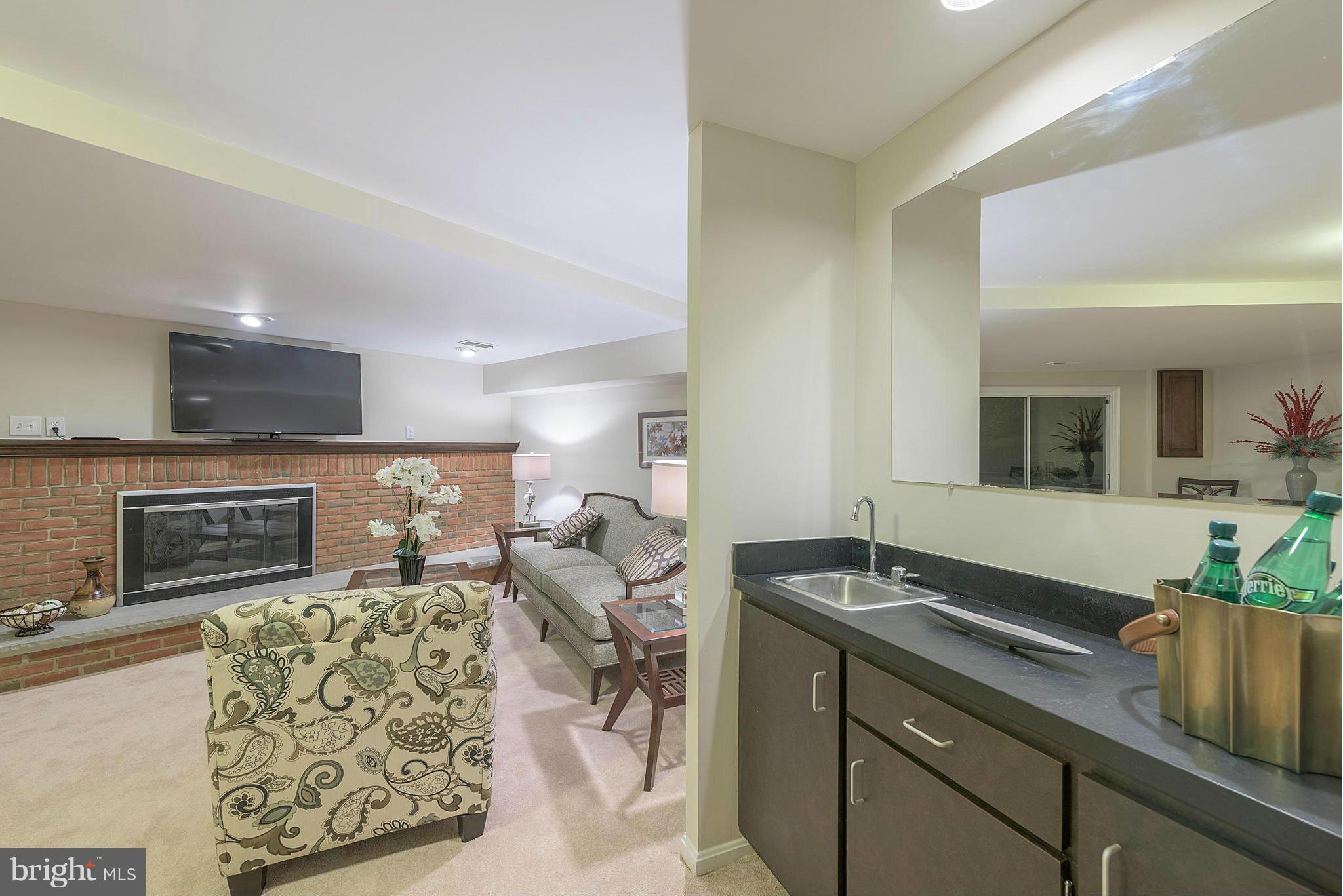 9122 Fisteris Court Springfield, VA 22152 - Photo 18 of 27 Fireplace and Wet Bar