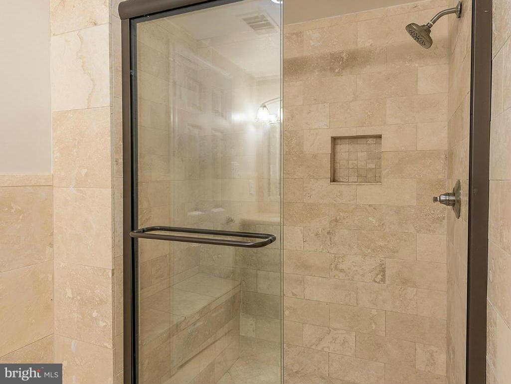 9122 Fisteris Court Springfield, VA 22152 - Photo 24 of 27 Over Sized Travertine Tile Shower with Seating