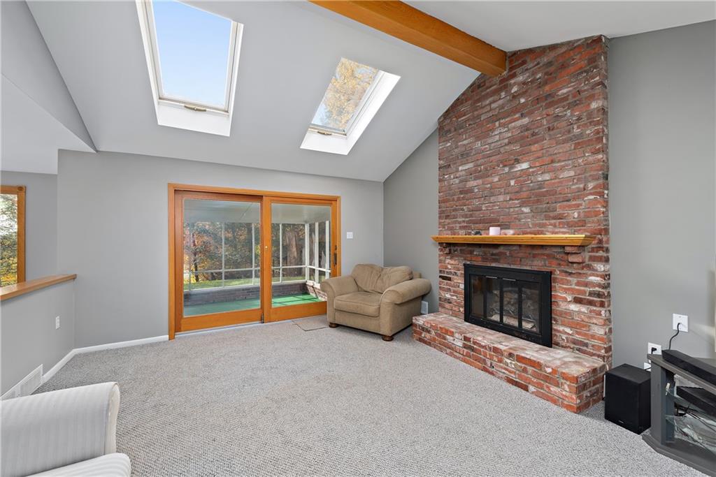 8210 Bramble Lane Pittsburgh, PA 15237 - Photo 12 of 25 a living room with furniture and a fireplace