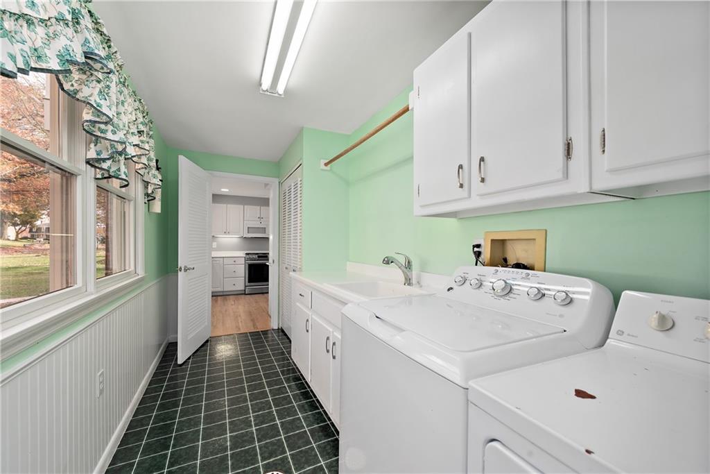 8210 Bramble Lane Pittsburgh, PA 15237 - Photo 13 of 25 a kitchen with a sink a stove and cabinets