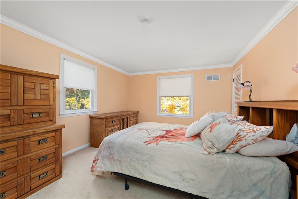 8210 Bramble Lane Pittsburgh, PA 15237 - Photo 19 of 25 a bedroom with a bed and a dresser