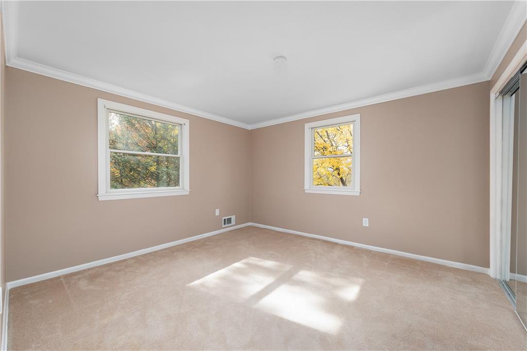 8210 Bramble Lane Pittsburgh, PA 15237 - Photo 20 of 25 an empty room with windows and closet