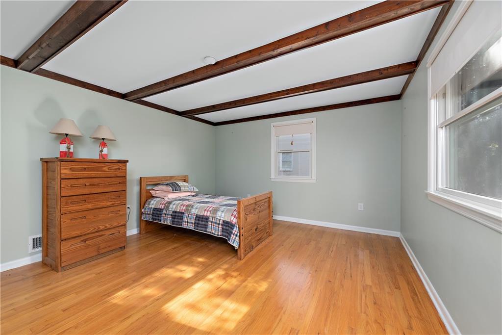 8210 Bramble Lane Pittsburgh, PA 15237 - Photo 21 of 25 a bedroom with a bed and a window
