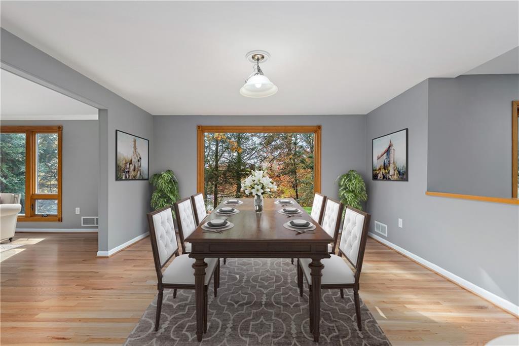 8210 Bramble Lane Pittsburgh, PA 15237 - Photo 3 of 25 a view of a dining room with furniture window and wooden floor