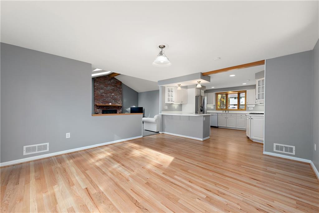 8210 Bramble Lane Pittsburgh, PA 15237 - Photo 7 of 25 a view of a kitchen with wooden floor and windows
