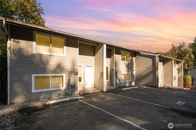 a front view of a house with a garage