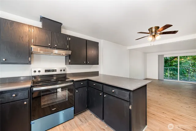 a kitchen with a stove and a sink