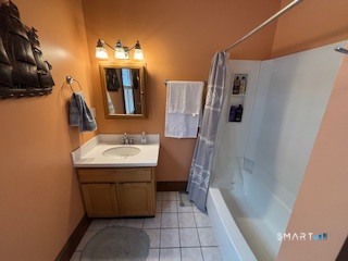 445 Church Street, Unit 2 Wallingford, CT 06492 - Photo 12 of 15 a bathroom with a sink and mirror with bathtub