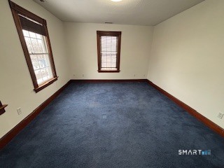 445 Church Street, Unit 2 Wallingford, CT 06492 - Photo 8 of 15 an empty room with windows
