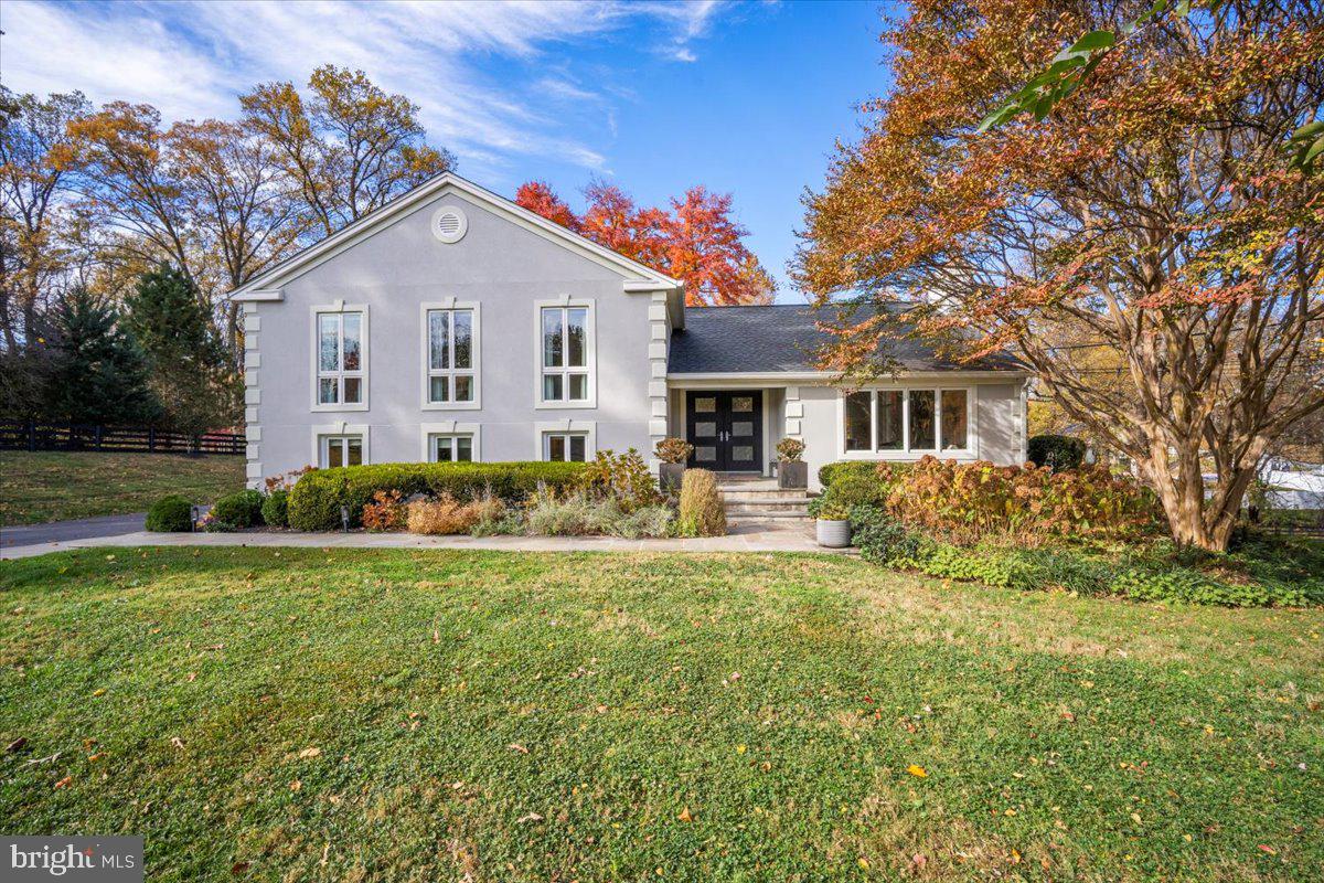 10801 Spring Knoll Drive Potomac, MD 20854 - Photo 1 of 100 a front view of a house with a yard