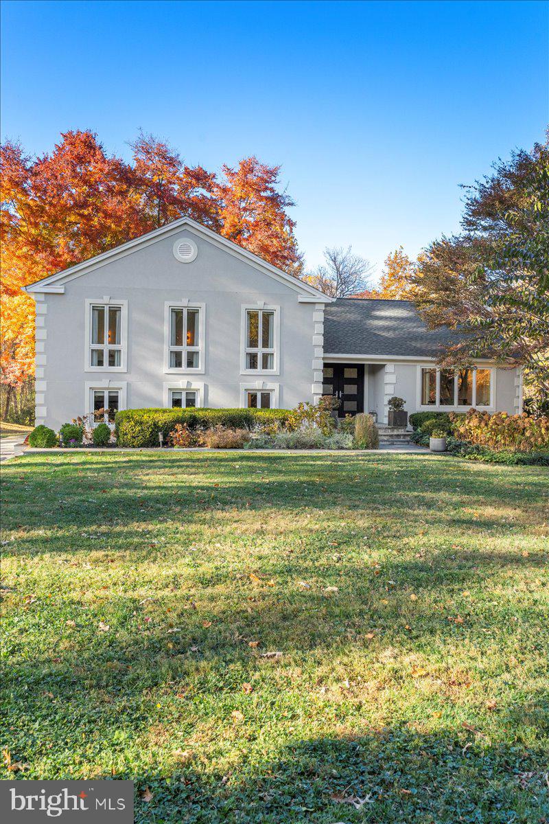 10801 Spring Knoll Drive Potomac, MD 20854 - Photo 2 of 100 a front view of a house with a big yard