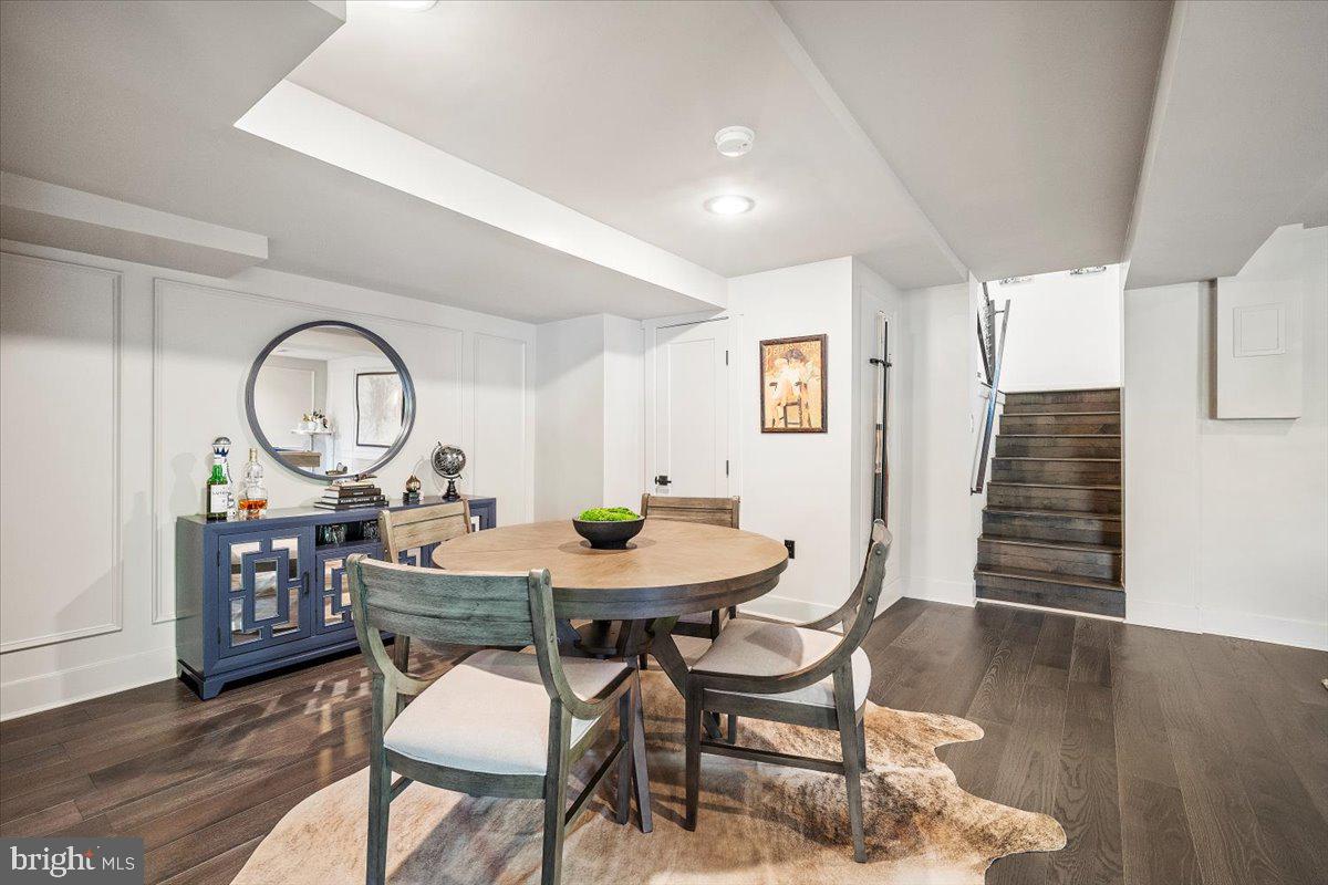 10801 Spring Knoll Drive Potomac, MD 20854 - Photo 65 of 100 a view of a dining room with furniture and a clock
