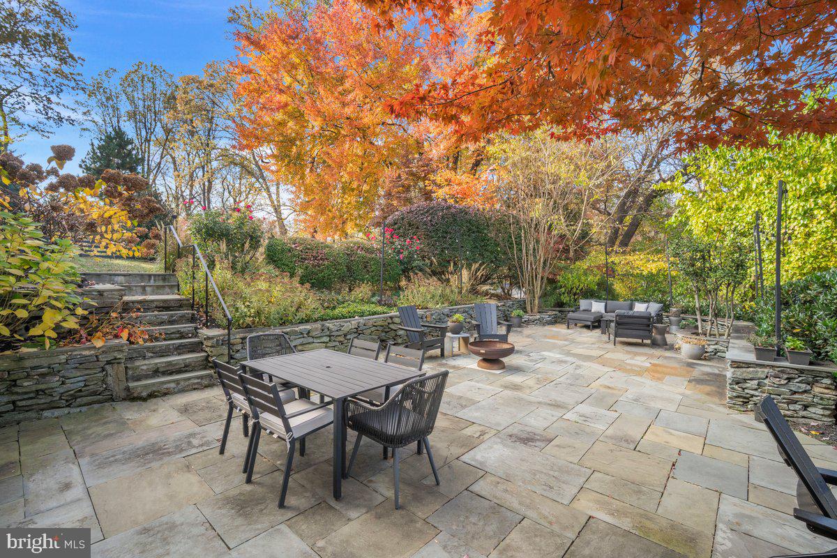 10801 Spring Knoll Drive Potomac, MD 20854 - Photo 82 of 100 a view of a patio with table and chairs and potted plants