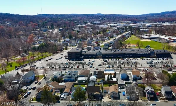 an aerial view of residential houses and outdoor space