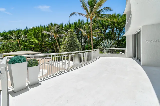 a view of a swimming pool with a yard