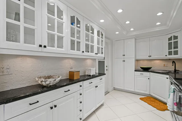 a kitchen with stainless steel appliances kitchen island granite countertop a cabinets and a sink