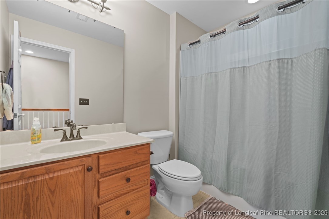 16 Cottswold Lane Spring Lake, NC 28390 - Photo 31 of 49 a bathroom with a sink a toilet and shower