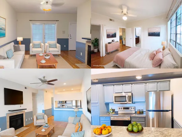 a living room with stainless steel appliances furniture and a kitchen view