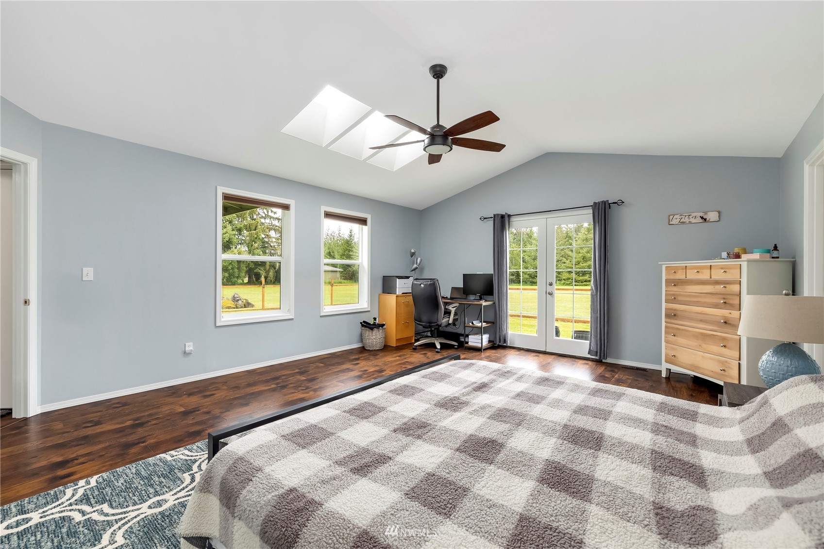 12035 Hunter Loop Road Southwest Rochester, WA 98579 - Photo 14 of 29 a bed room with a bed and a tv