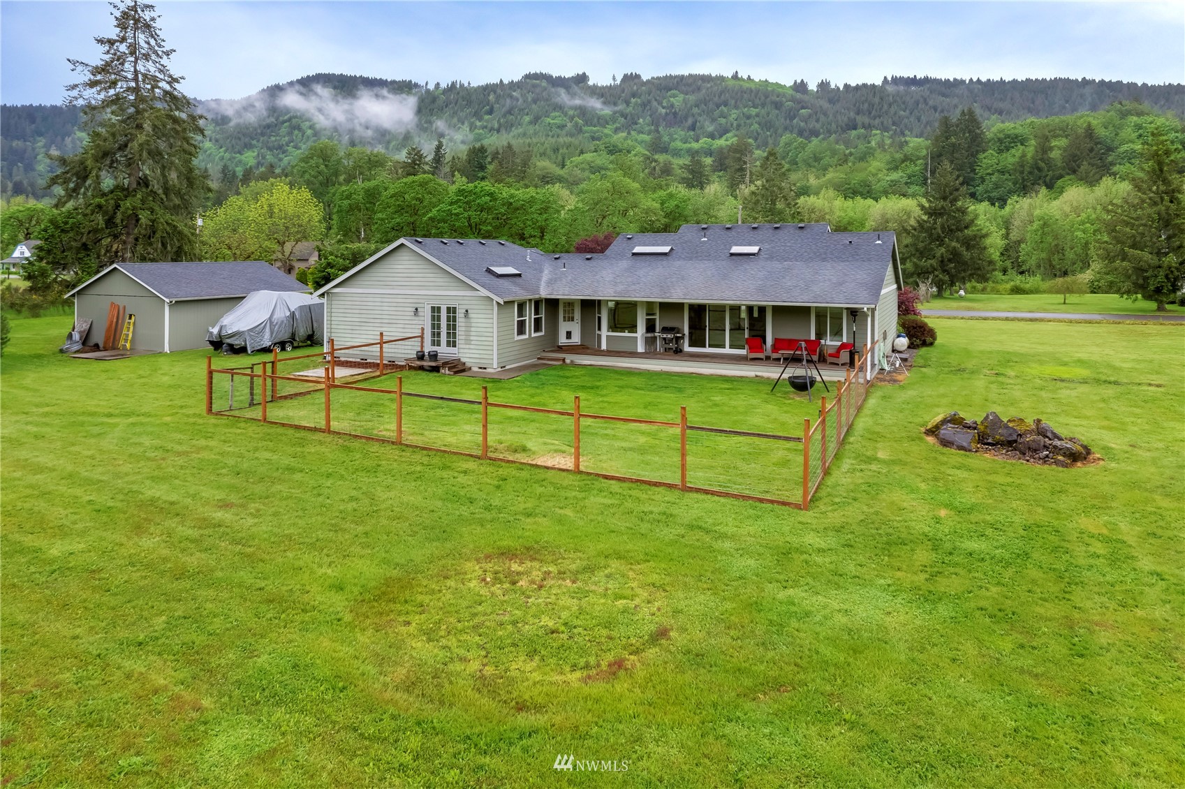 12035 Hunter Loop Road Southwest Rochester, WA 98579 - Photo 29 of 29 a view of a house with a big yard