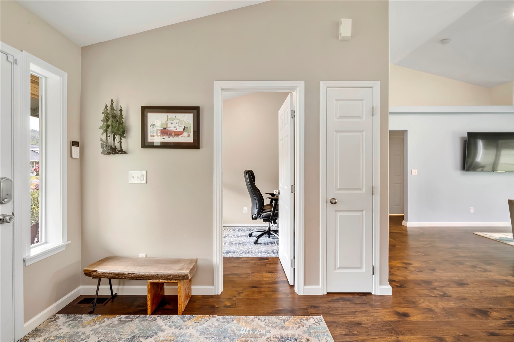 12035 Hunter Loop Road Southwest Rochester, WA 98579 - Photo 7 of 29 a living room with furniture and a wooden floor