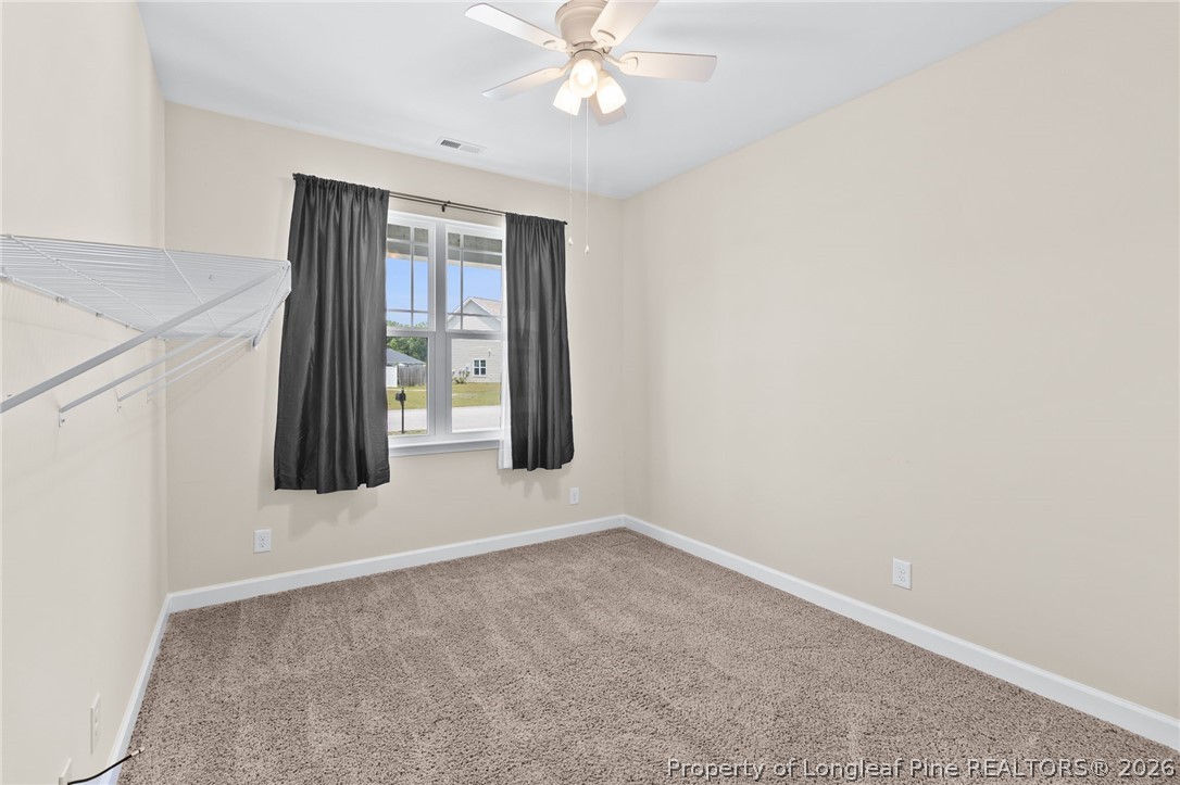 216 Meherrin Loop Raeford, NC 28376 - Photo 22 of 38 an empty room with windows and closet
