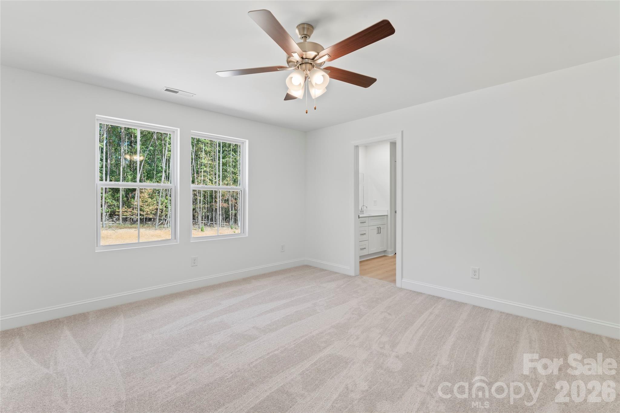 753 Mockingbird Road, Unit 2 Albemarle, NC 28001 - Photo 22 of 36 an empty room with window and ceiling fan