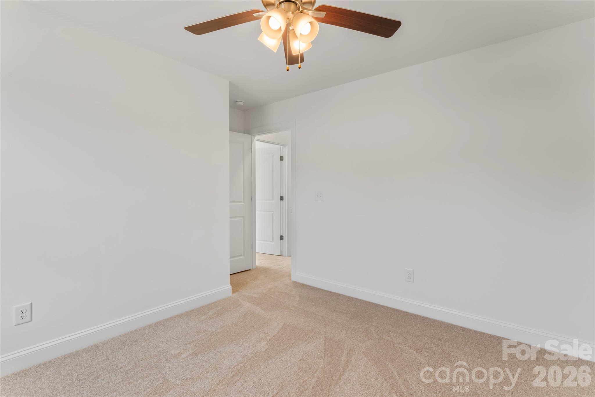 753 Mockingbird Road, Unit 2 Albemarle, NC 28001 - Photo 36 of 36 an empty room with a chandelier fan