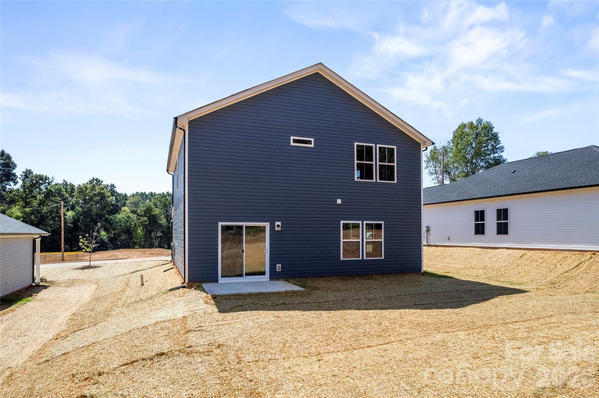 753 Mockingbird Road, Unit 2 Albemarle, NC 28001 - Photo 4 of 36 a front view of a house with a yard and garage