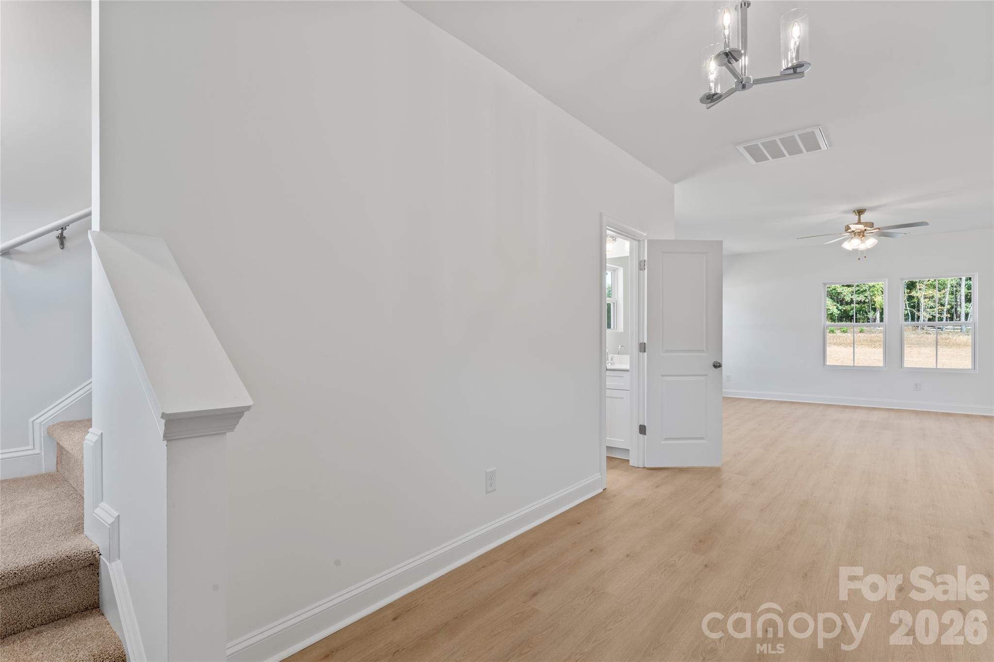 753 Mockingbird Road, Unit 2 Albemarle, NC 28001 - Photo 8 of 36 wooden floor in an empty room with a window