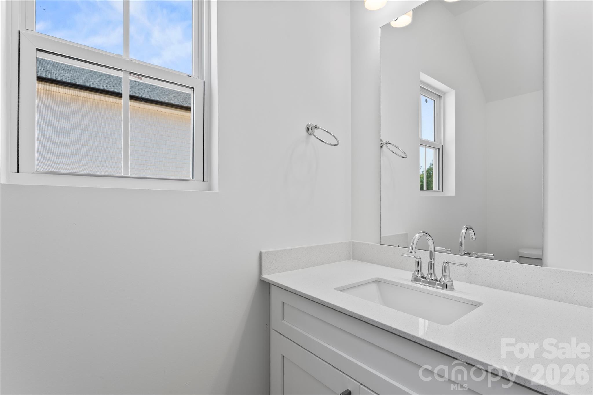 753 Mockingbird Road, Unit 2 Albemarle, NC 28001 - Photo 9 of 36 a bathroom with a granite countertop sink and a mirror