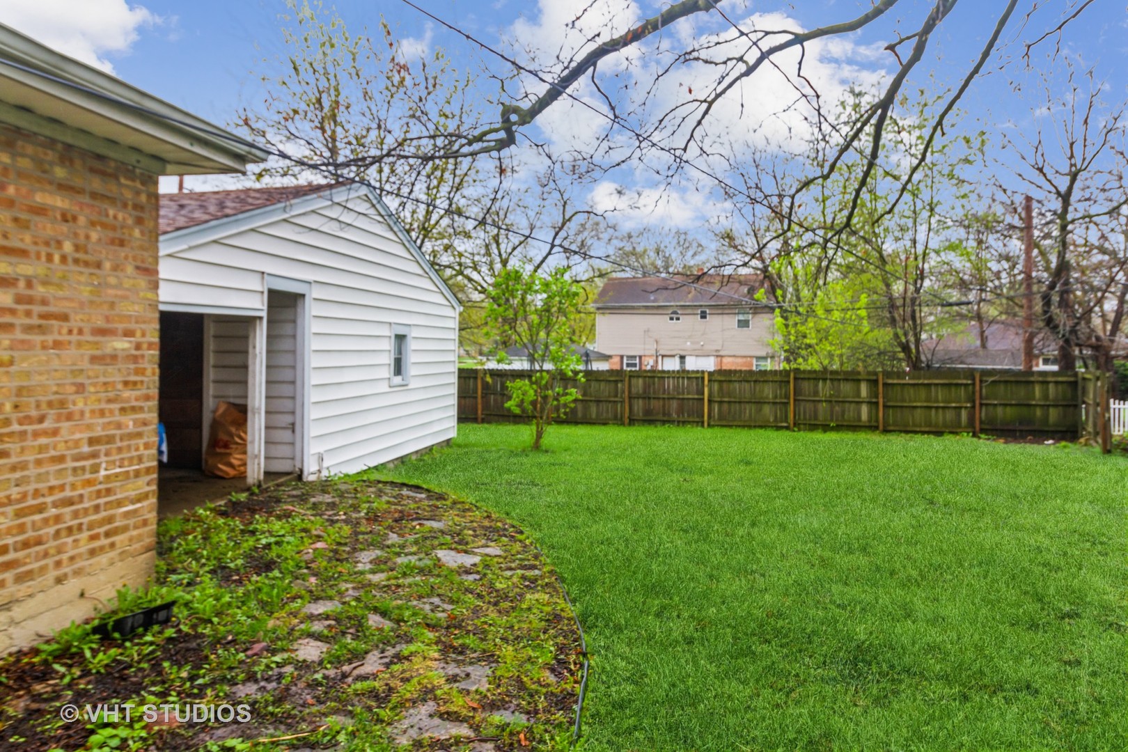 17560 Sycamore Drive Homewood, IL 60430 - Photo 12 of 13 a view of a yard with a large tree